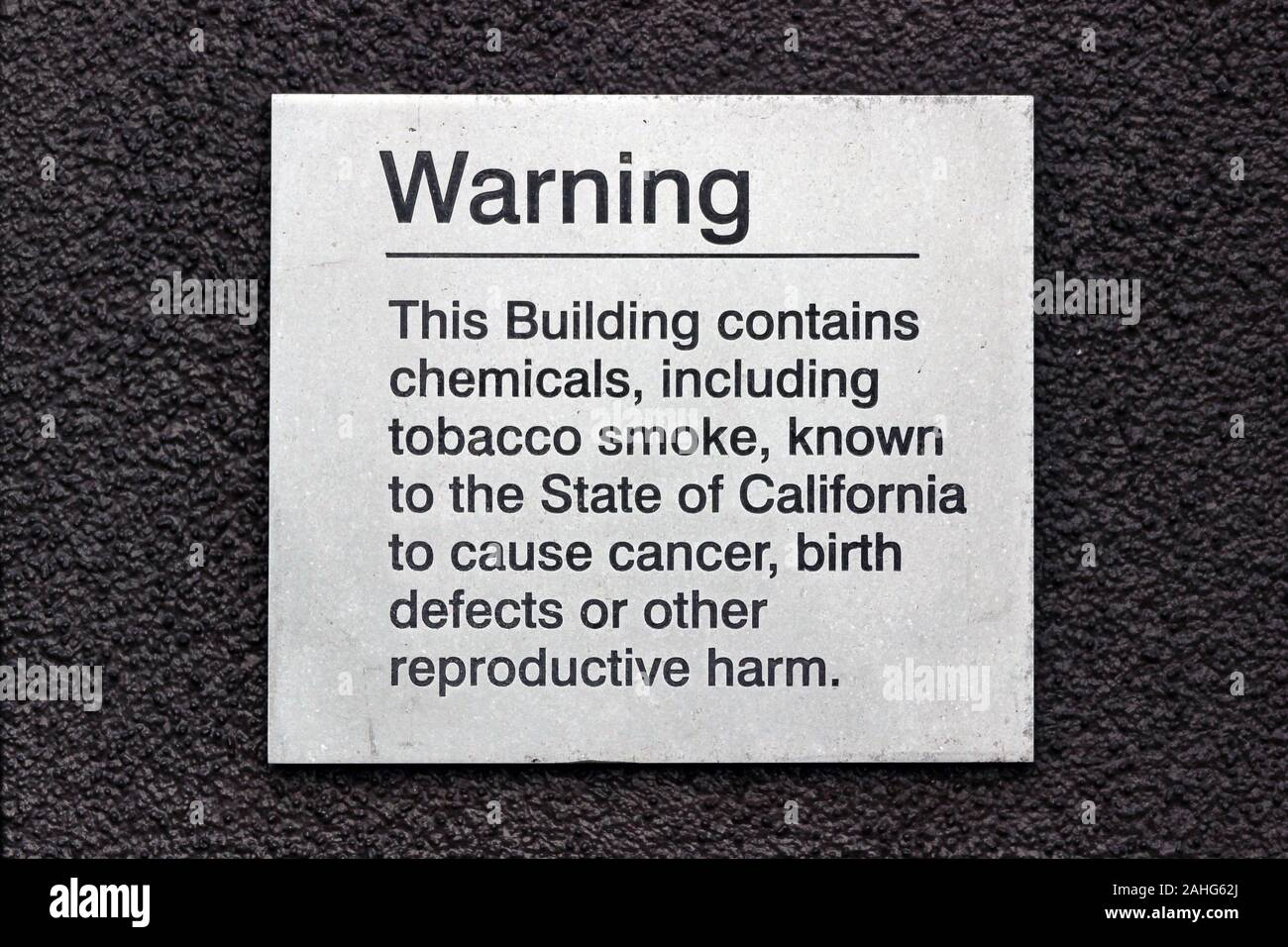 Proposition 65 warning sign on hotel wall in San Francisco, United States Stock Photo