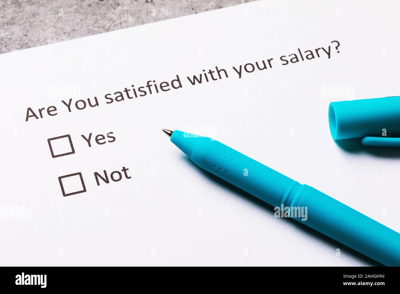 Pen and sheet of paper on the table. Concept on Anonymous Survey on Living Standards Stock Photo