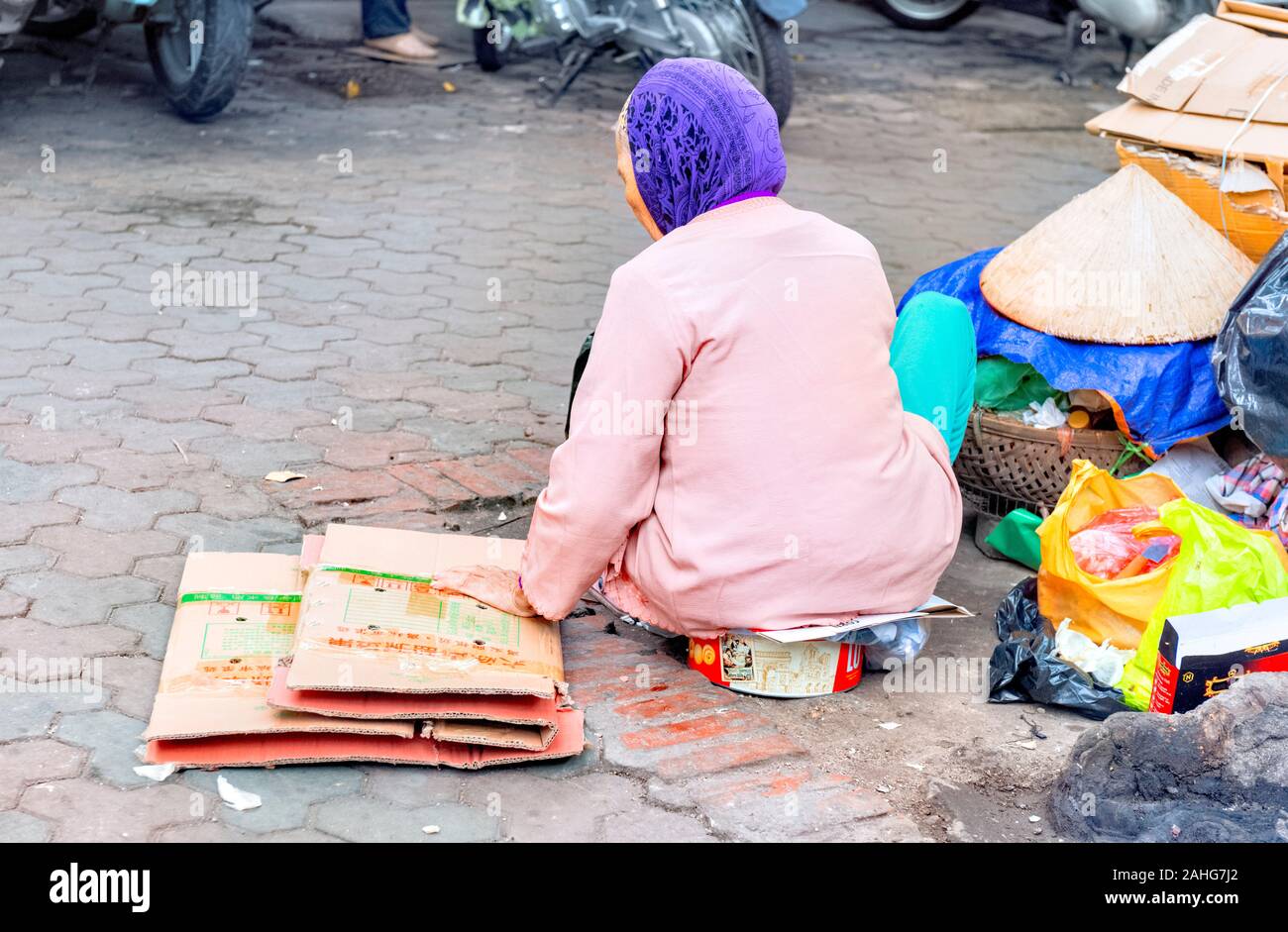 Elderly Vietnamese Lady collecting cardboard Hanoi Vietnam Stock Photo
