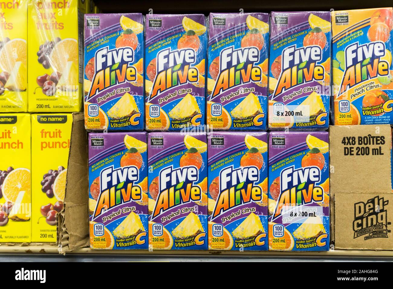 Tetra pak cartons of Five Alive Tropical Citrus fruit juice for sale on the shelves of a Canadian supermarket. Stock Photo