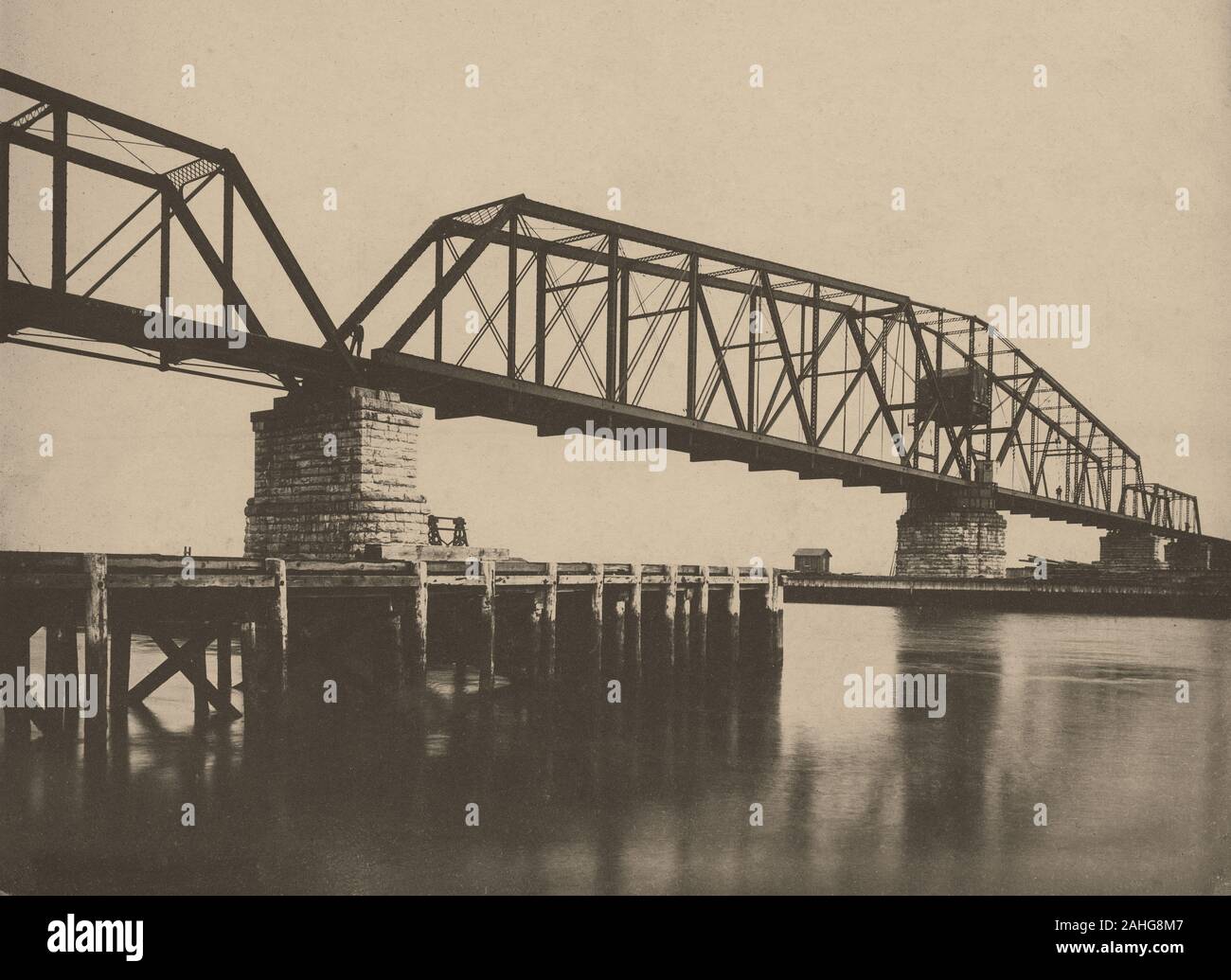 Antique c1890 photograph, “longest drawbridge in the world, B&O railroad over Arthur Kill between Elizabethport, NJ and Staten Island, NY.” The Arthur Kill Bridge was a railroad bridge connecting Staten Island to New Jersey's Chemical Coast, opening with ceremony on January 1, 1890. SOURCE: ORIGINAL CYANOTYPE PHOTOGRAPH Stock Photo