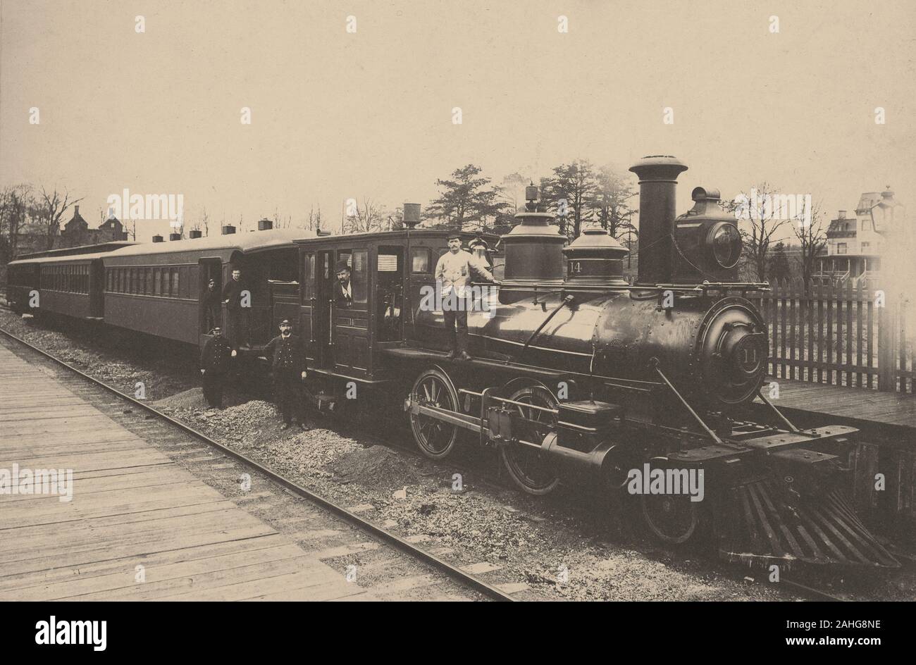 Antique c 1890 photograph, “train and crew on the Staten Island Rapid Transit” with engine number 14. SOURCE: ORIGINAL CYANOTYPE PHOTOGRAPH Stock Photo