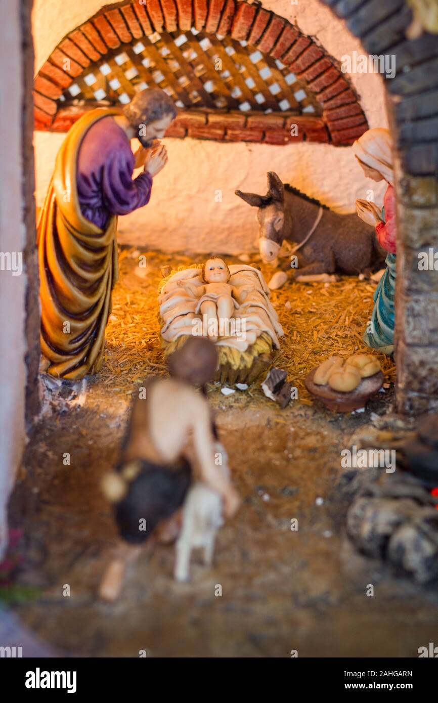 Nativity scene with figures of Joseph, mother Mary, donkey and baby