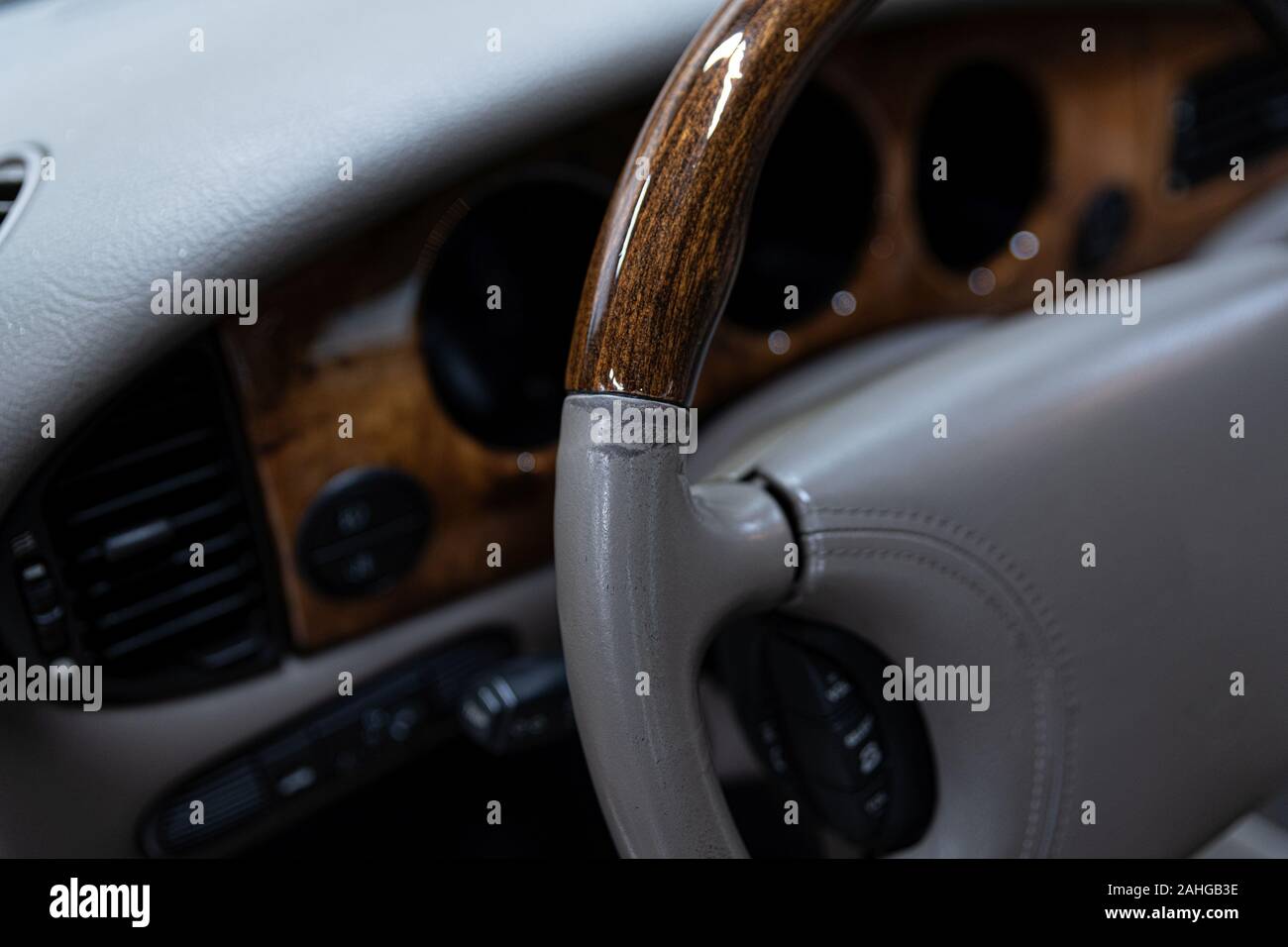 Damaged leather steering wheel in classic car Stock Photo Alamy