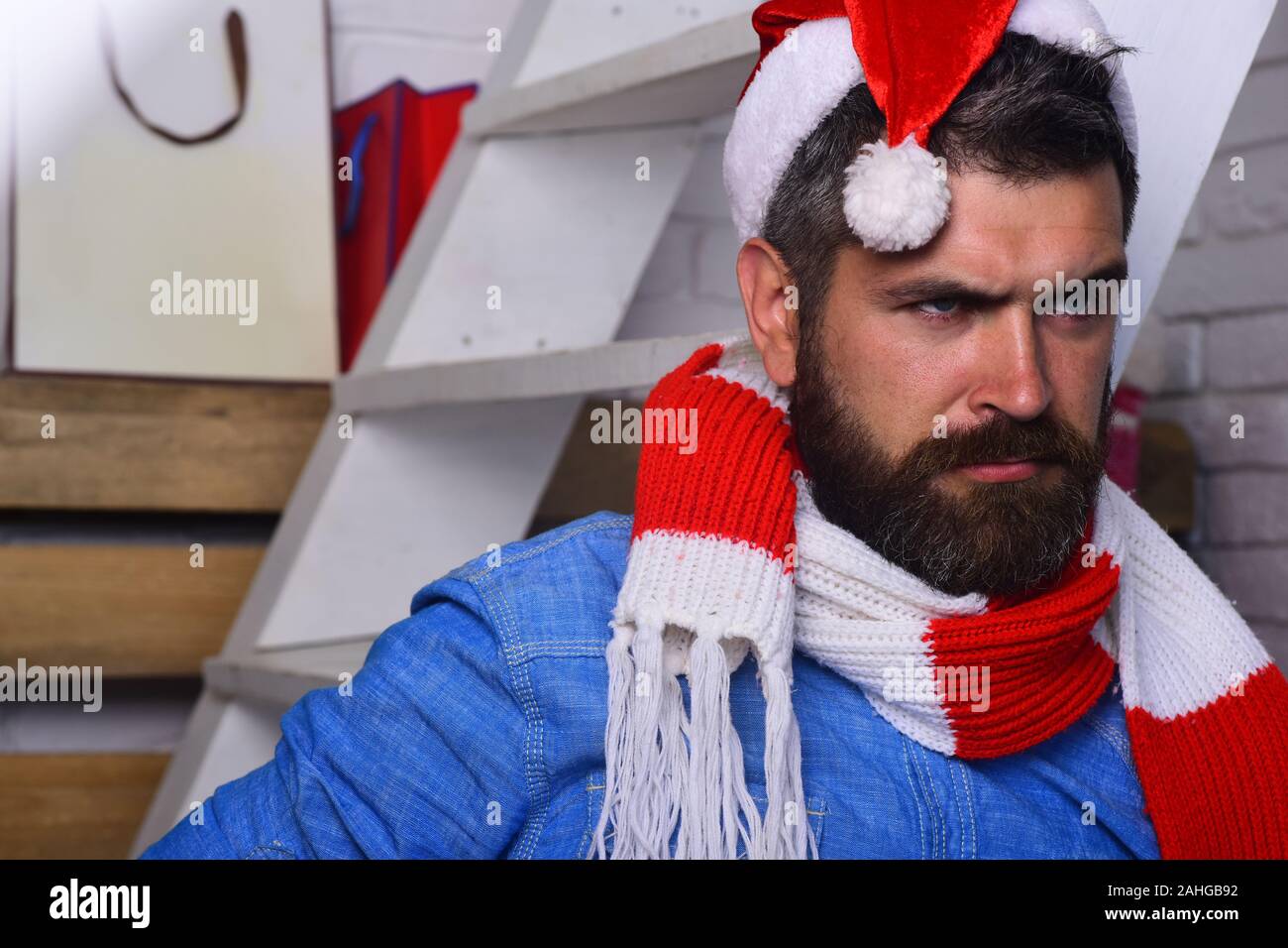 Holidays and presents concept. Guy with beard and concerned face ...