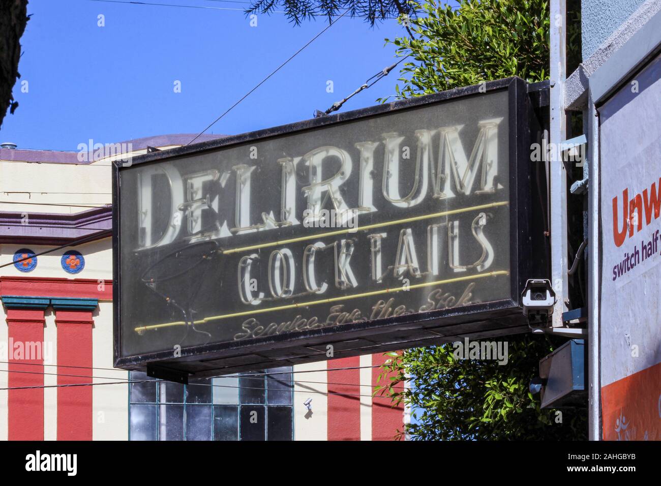 Delirium Cocktails bar neon sign in Mission District of San Francisco, United States of America. Service for the Sick. Stock Photo