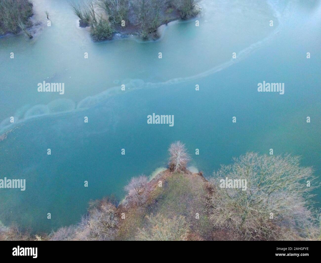 Flying over forest frozen lake hi-res stock photography and images - Alamy
