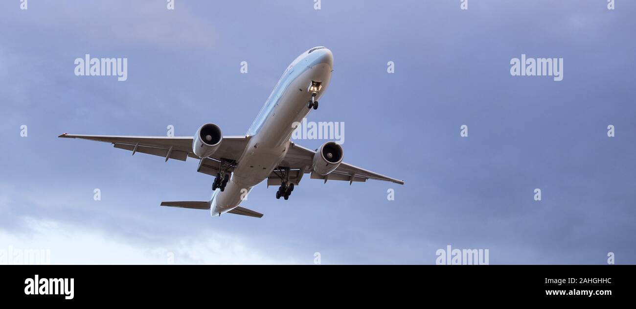 Commercial passenger jet aircraft at the sky Stock Photo