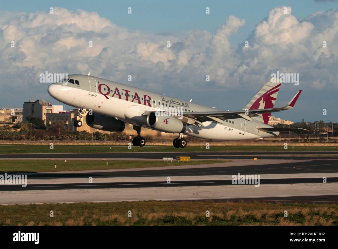 Qatar Airways Airbus A320-200 passenger jet plane taking off from the runway at Malta International Airport. Modern air travel and commercial flight. Stock Photo