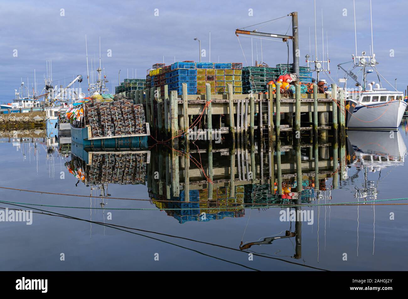 Fishing boats tied up wharf hi-res stock photography and images - Alamy