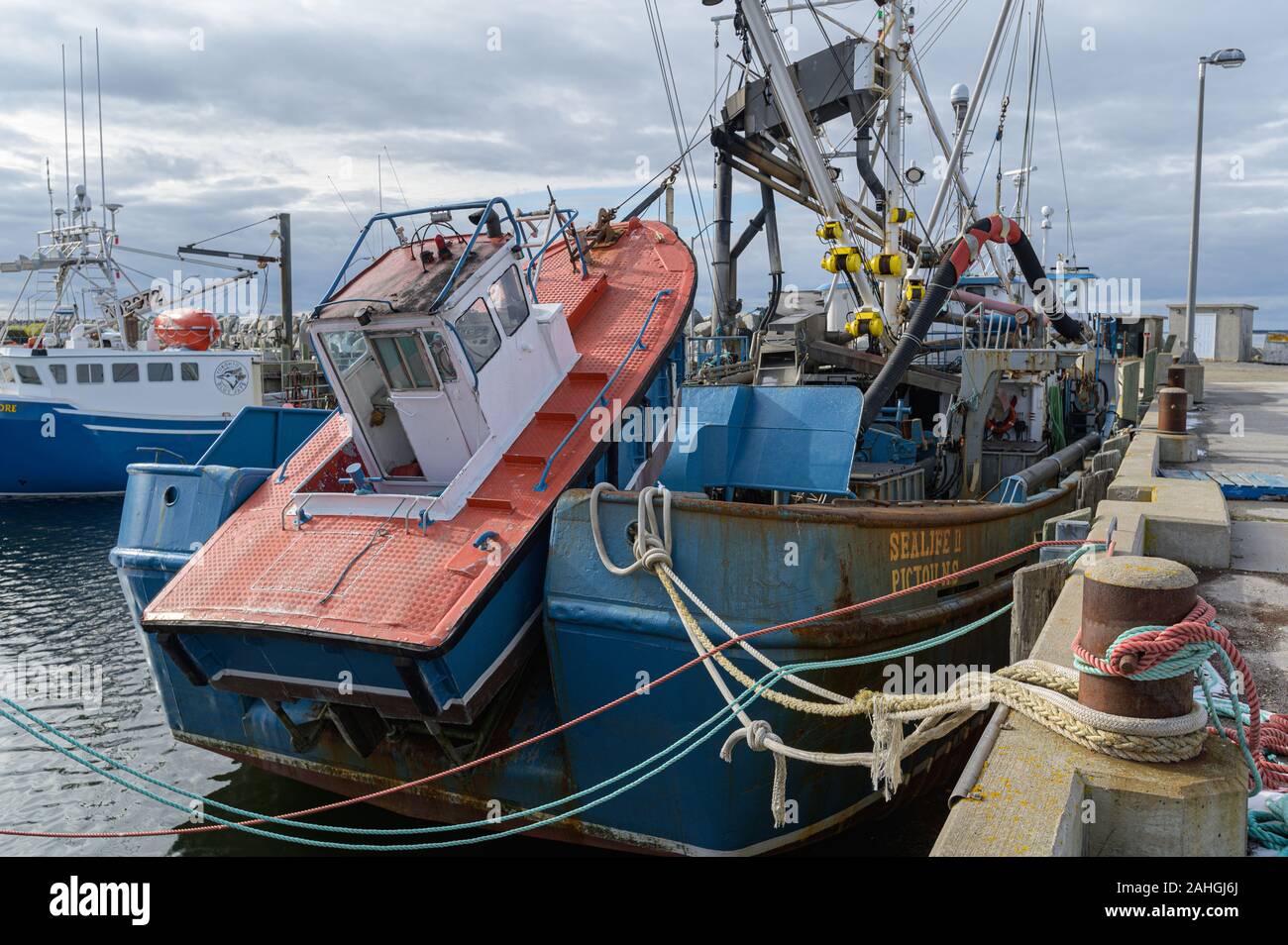Fishing boats tied up dock hi-res stock photography and images - Alamy
