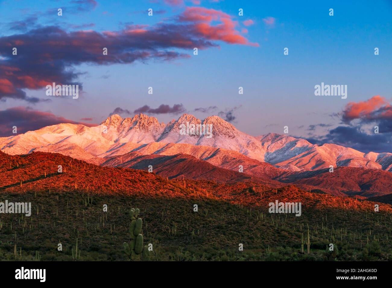 Sunset Image of the Snow covred Four Peaks Mountain Range Outside Phoenix AZ after storm Stock Photo