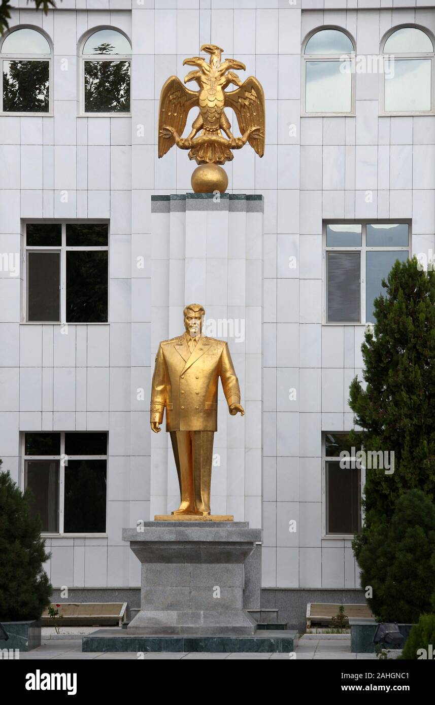 Gold statue of Saparmurat Niyazov under the five headed eagle in Ashgabat Stock Photo