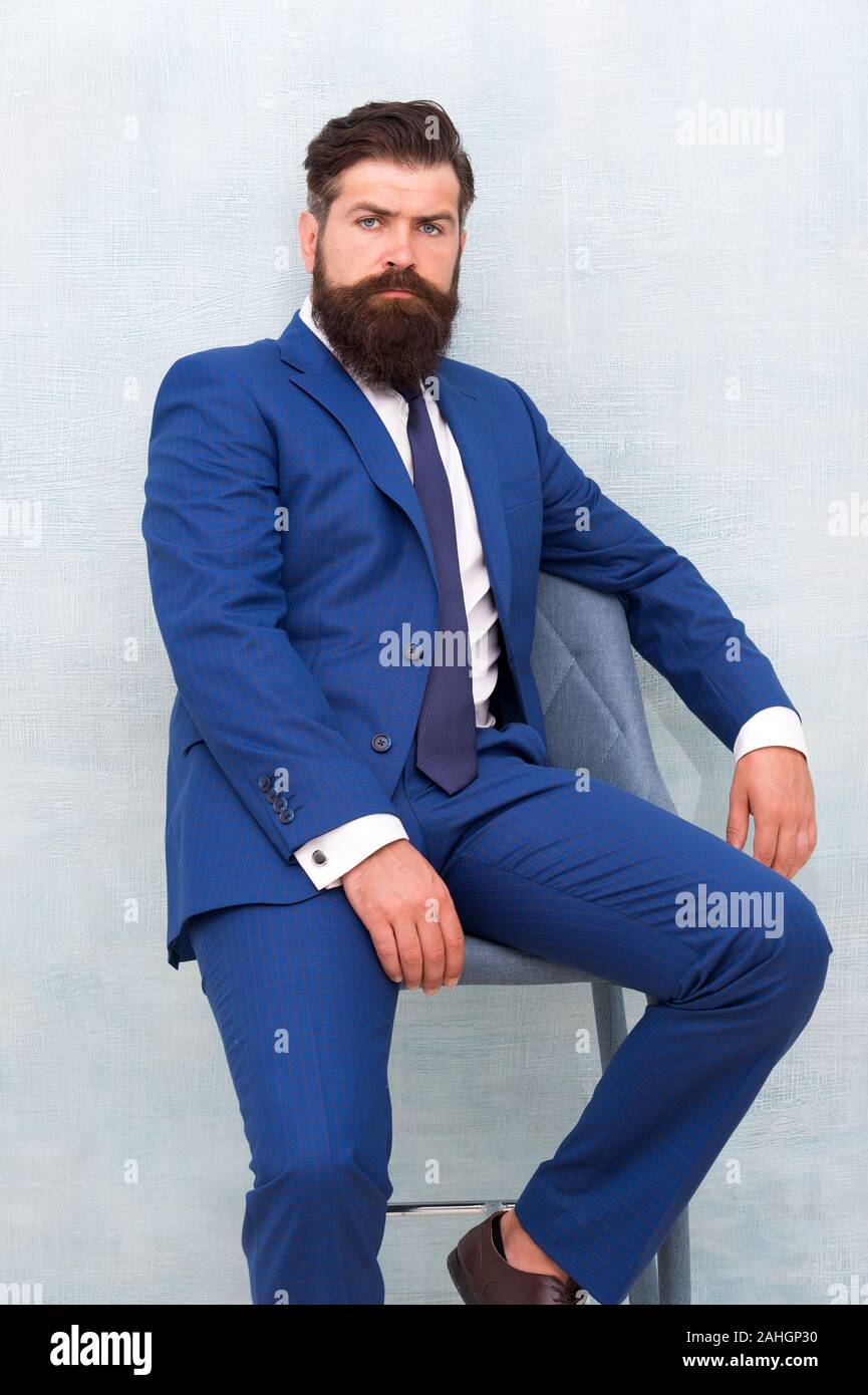 He is sure to impress. Confident businessman. Businessman sit on chair.  Bearded businessman in formal style. Businessman with beard and mustache  hair. Smart and professional look. Business dress code Stock Photo -