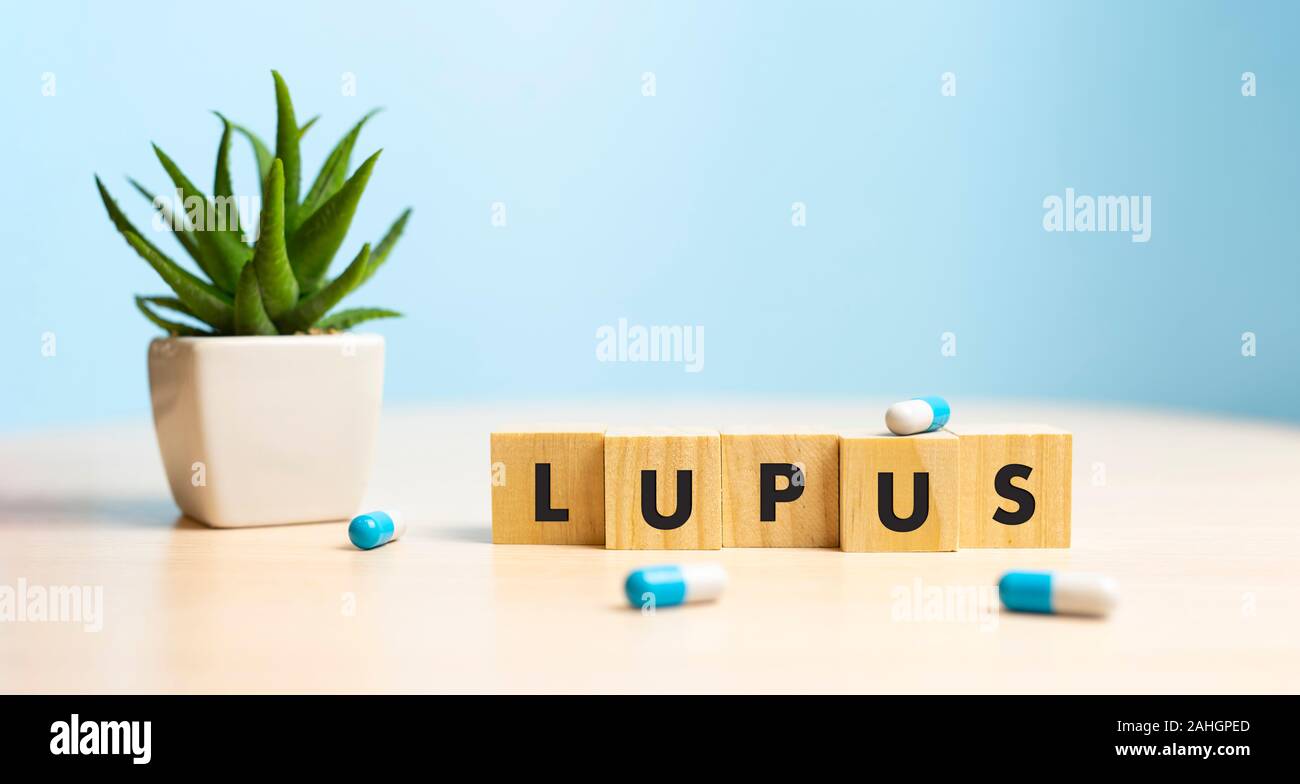 Wooden block form the word LUPUS. Medical concept. Stock Photo