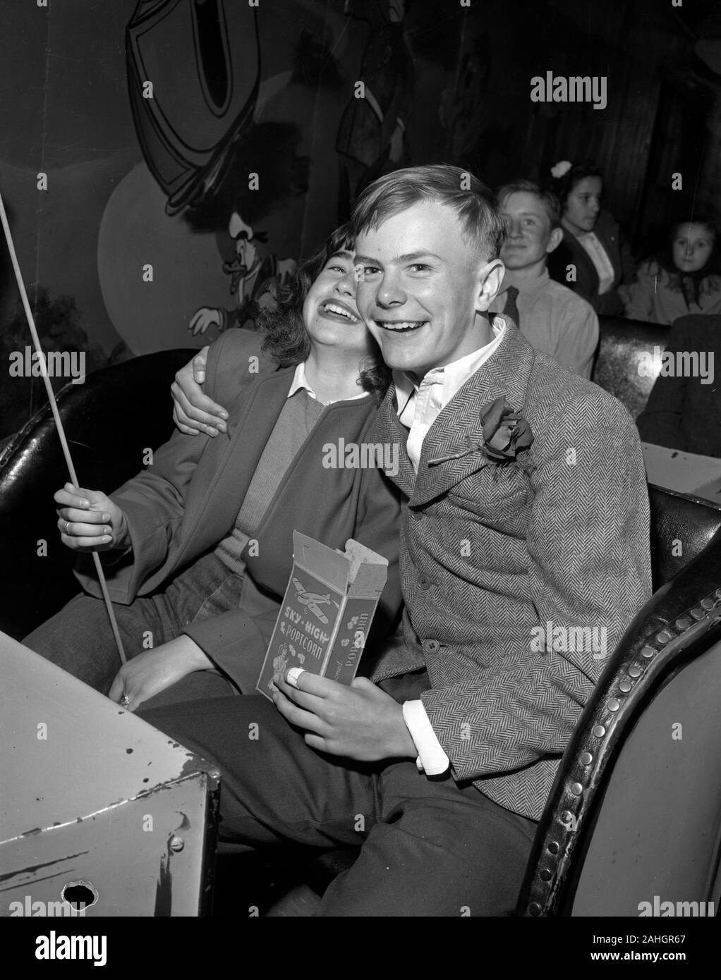 Teenagers on a date, on a carnival fun-house ride in Minnesota, around 1946 Stock Photo