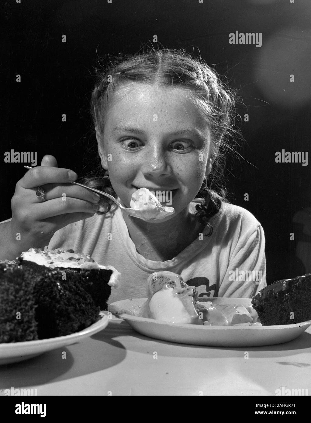 Girl eating ice cream 1946 Stock Photo