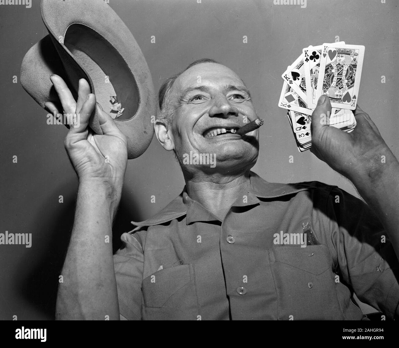 Photo of a man with playing cards 1946 Stock Photo