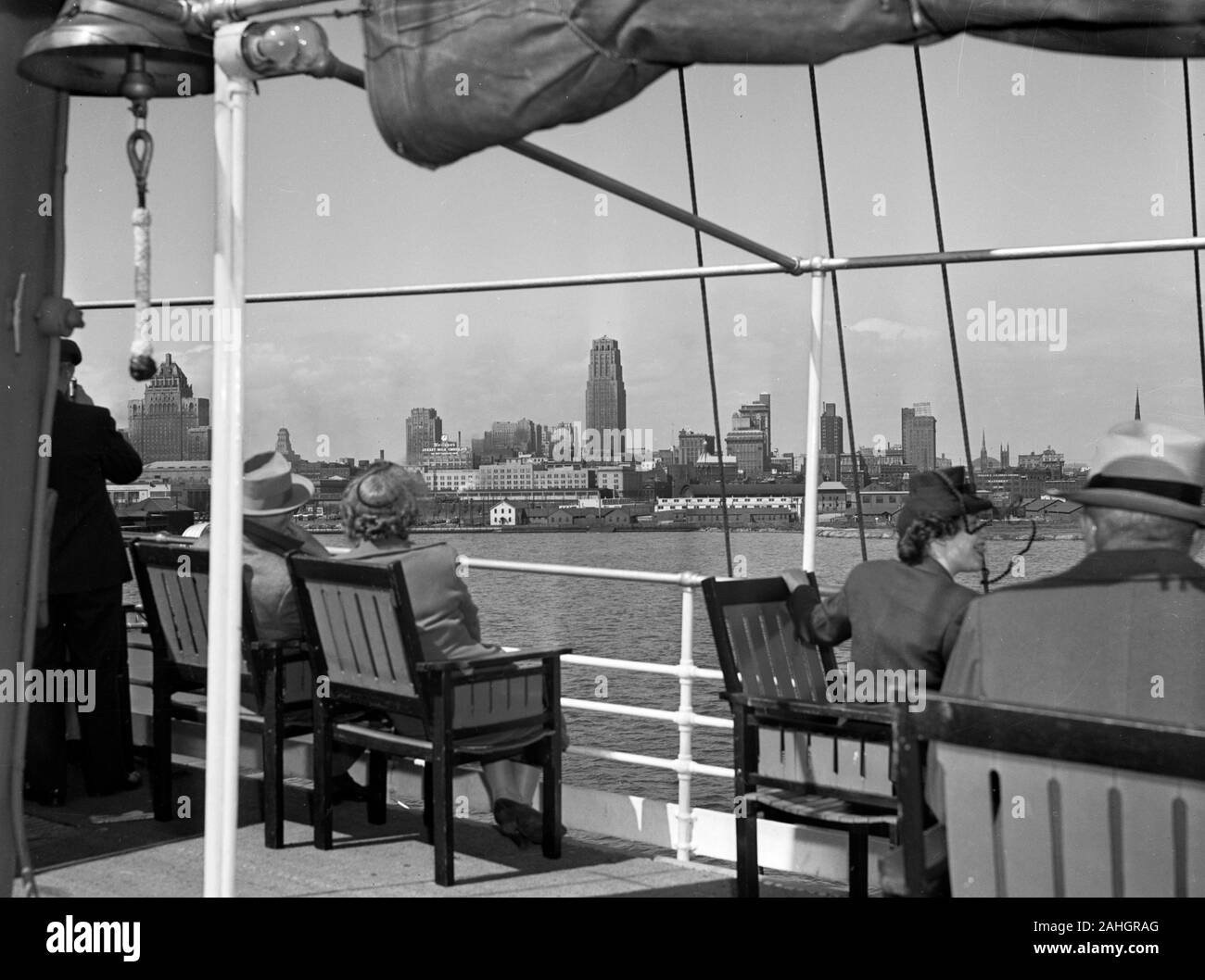 Passengers view the Toronto skyline from the deck of the passenger liner S.S. North America, 1942 Stock Photo
