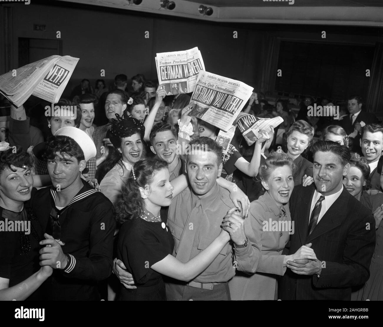 Servicement and others celebrate the surrender of Germany during World War Two, in Akron Ohio on May 7, 1945 Stock Photo