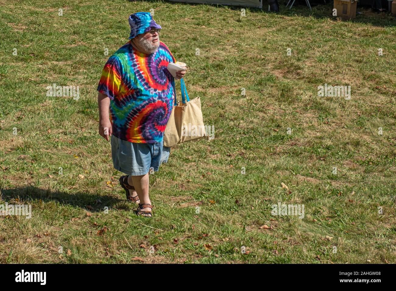 A man in colorful clothing at the garlic and Arts Festival in Orange, MA Stock Photo