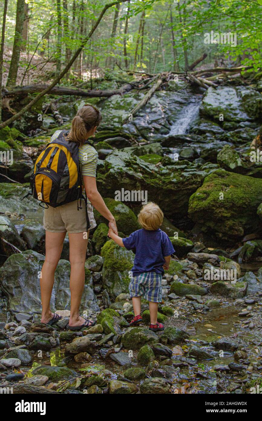 Mother and young son enjoying a day in the woods Stock Photo