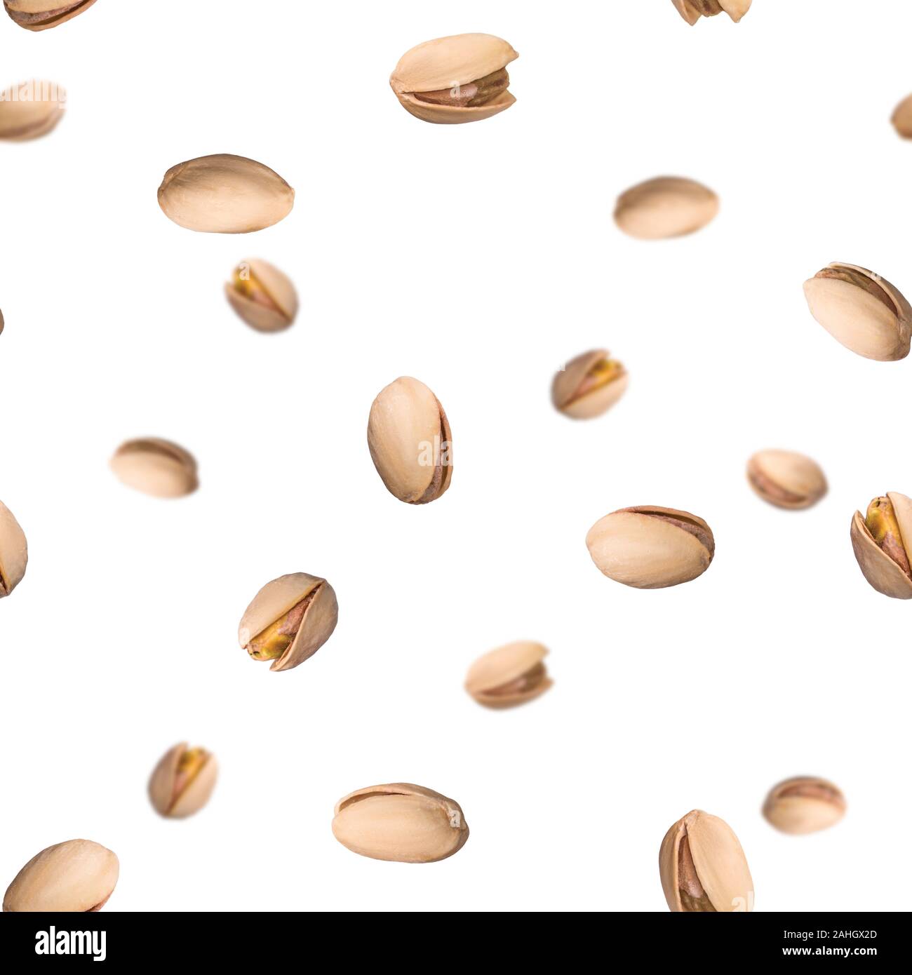Seamless pattern with falling pistachio nuts isolated on white background. Levity kernels. Stock Photo