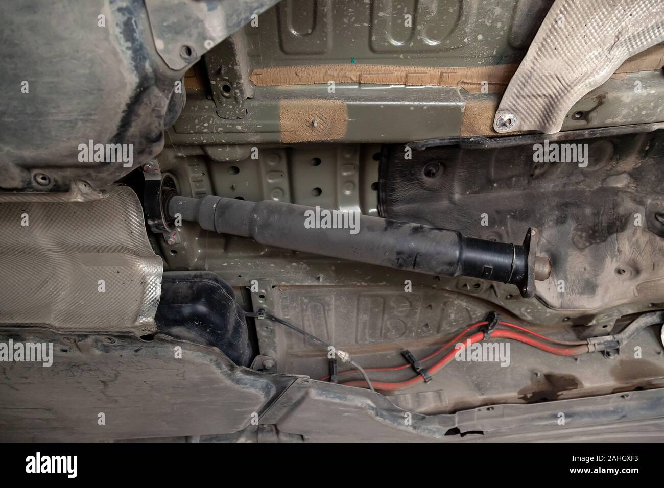 The drive shaft of the car on the bottom during the analysis and repair