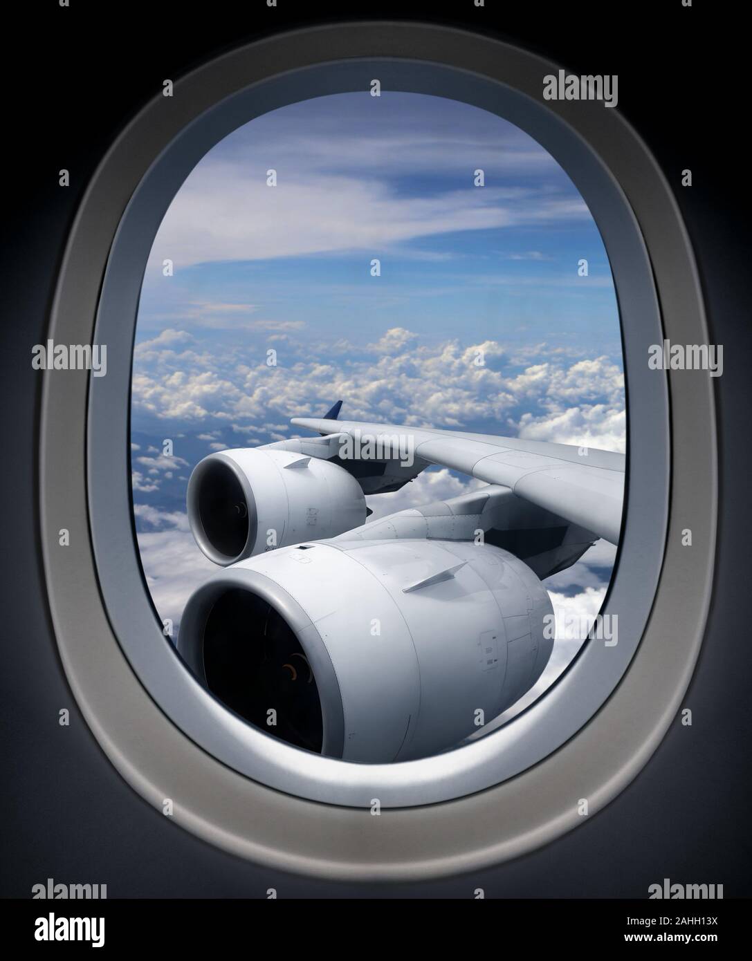 Airplane turbine engine from window view angle with cloudy blue sky ...