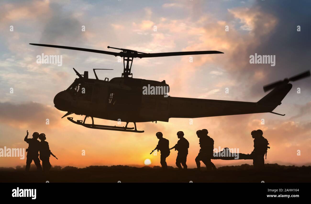 Military rescue helicopter during sunset Stock Photo - Alamy