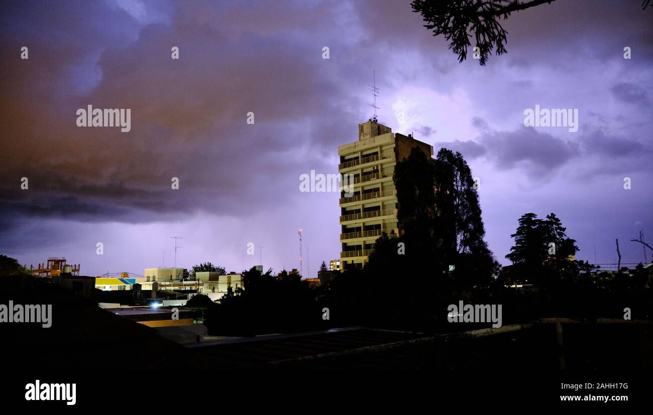dramatic skyline, the light hole between a dark storm clouds Stock Photo