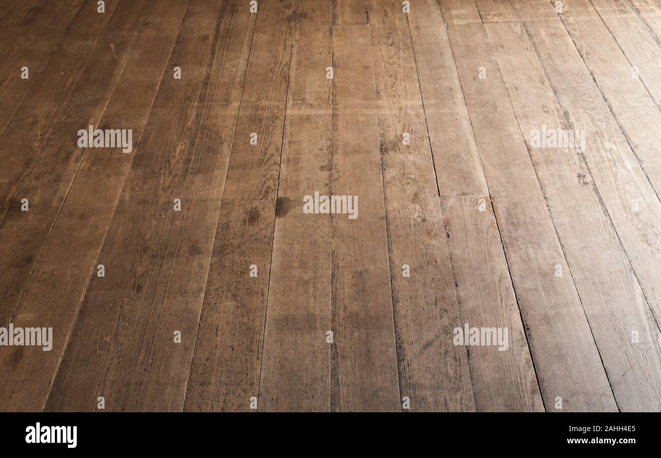 Wooden floor made of rough uncolored oak boards, background photo with perspective effect Stock Photo