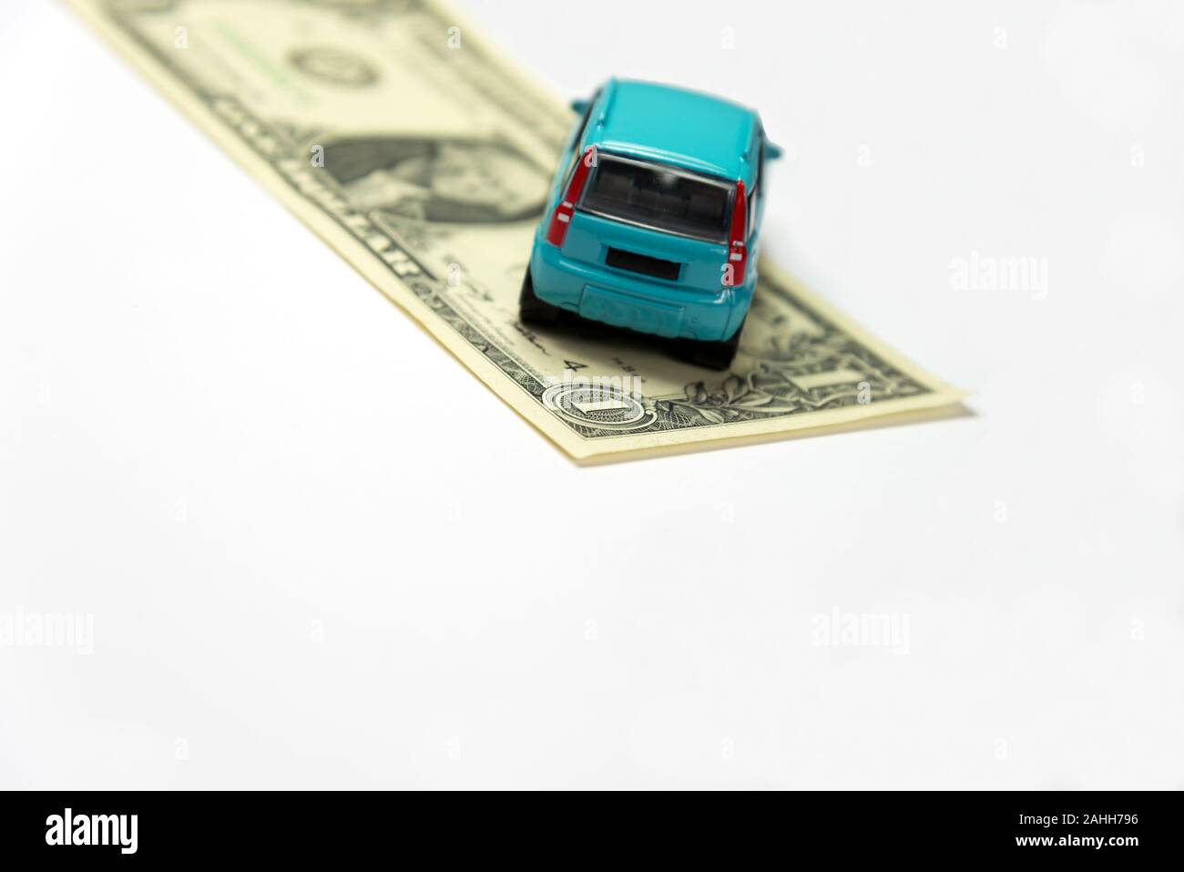 Dollar bill and a car Stock Photo - Alamy