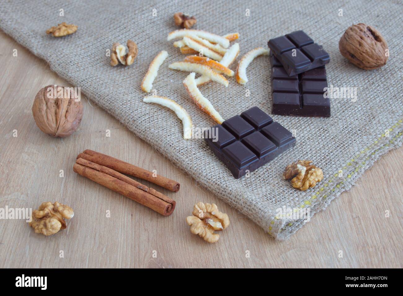High angle view of candied orange peel, chocolate, cinnamon and nuts Stock Photo