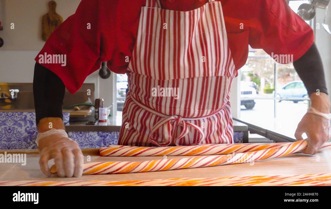 Peppermint candy. Chef making traditional holiday peppermint candies ...