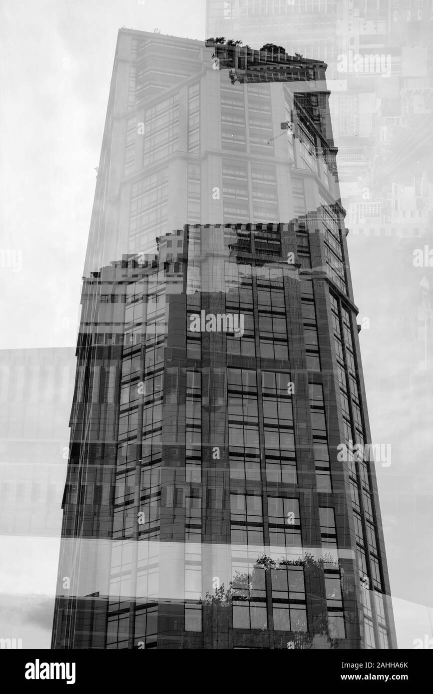Multiple Exposure Of Tall Corporate Buildings In Black And White Stock Photo