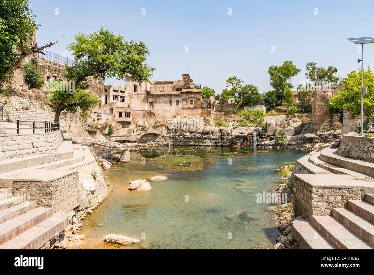 Chakwal Qila Katas Raj Hindu Temples Dedicated to Shiva Picturesque View of the Pond on a Sunny Blue Sky Day Stock Photo