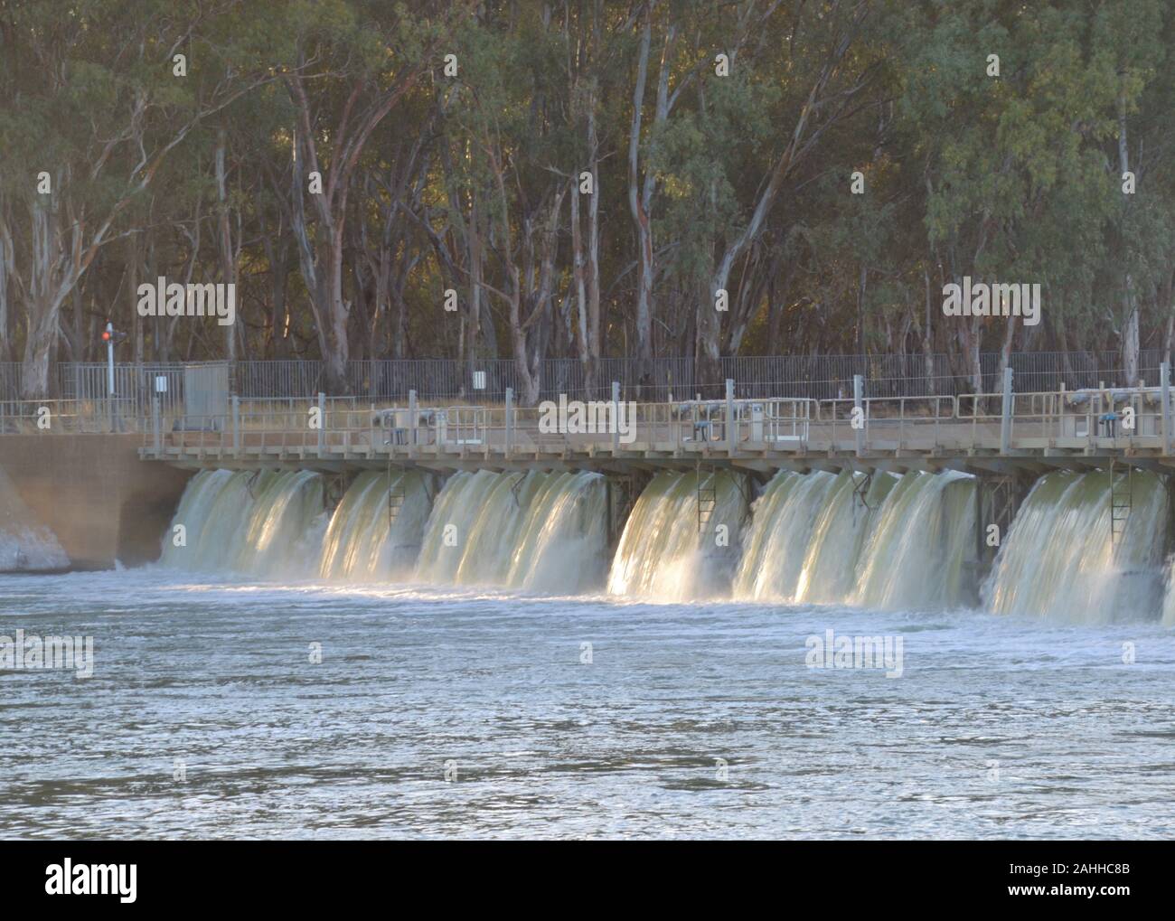 Water flowing over Murray River weir at Lock 11 outside Mildura in Australia Stock Photo