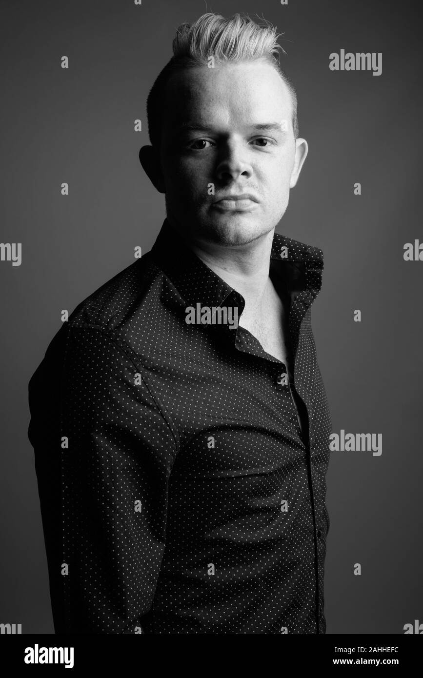 Portrait Of Businessman With Mohawk Hairstyle And Blond Hair Stock