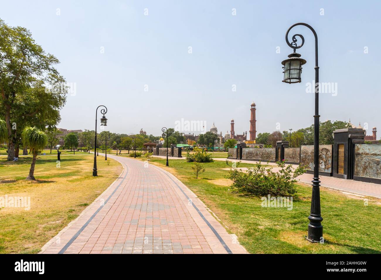 Lahore Iqbal Park Picturesque View with Leading Lines Walkway and Street Lights on a Sunny Blue Sky Day Stock Photo