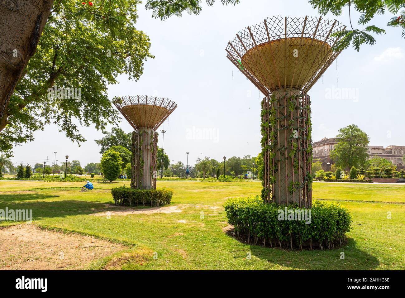 Lahore Iqbal Park Picturesque View of Two Pillars with Clipped Hedges on a Sunny Blue Sky Day Stock Photo