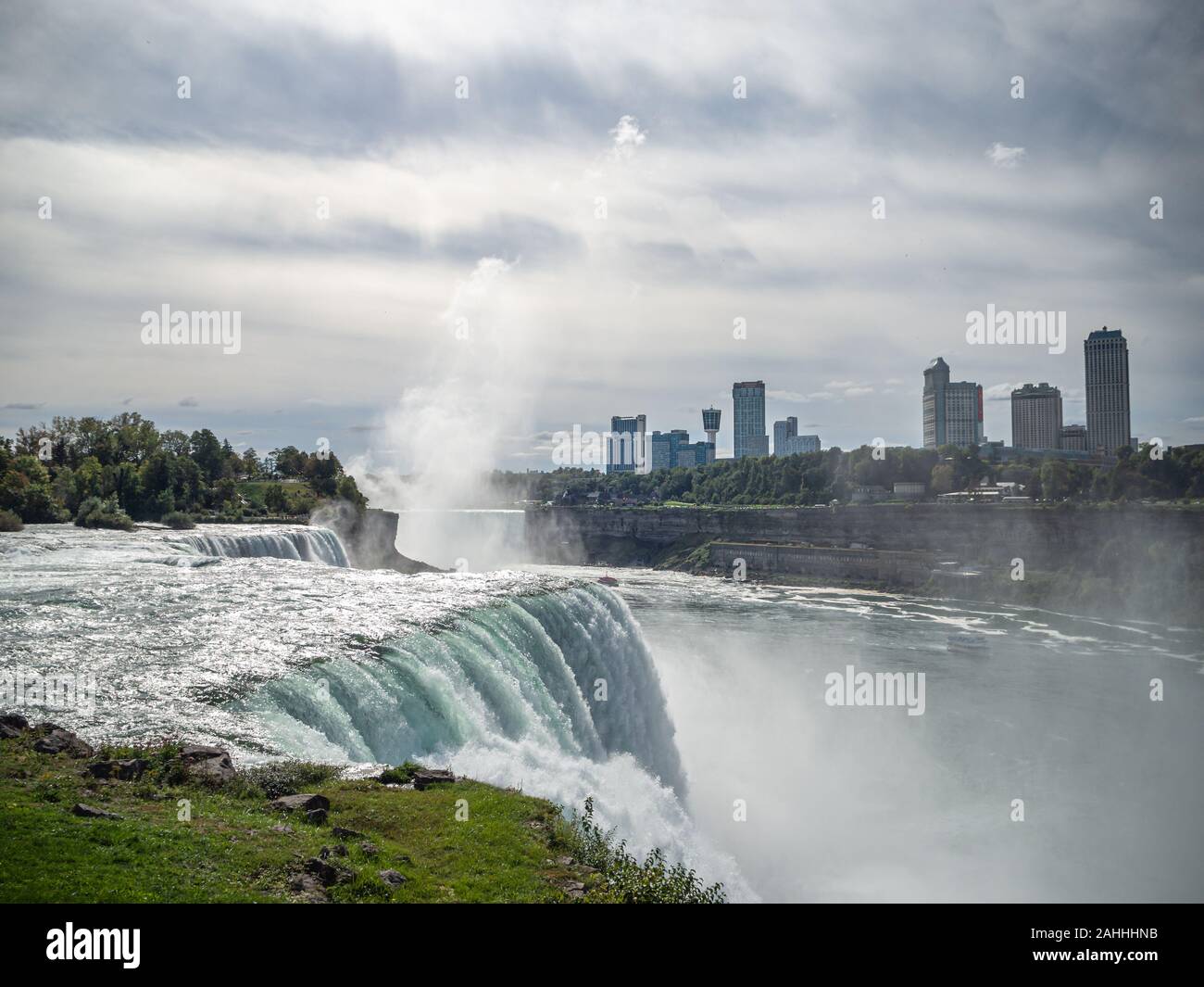 Niagara Falls, New York state, United States of America and Canada -edge of falls, town from American and Canadian city side, falling water and mist Stock Photo