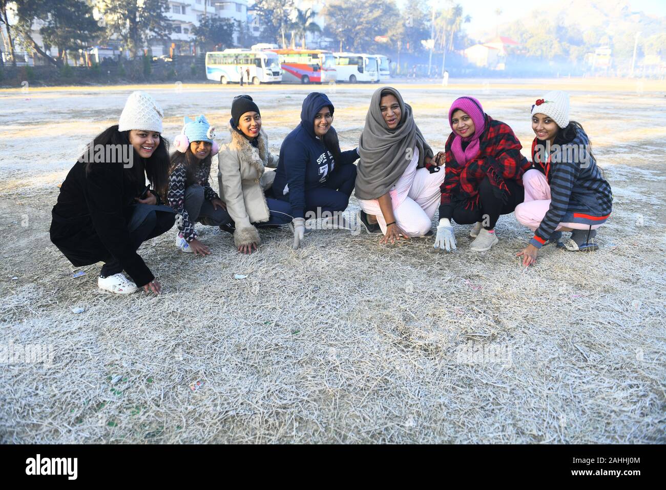 Mount Abu, India. 30th Dec, 2019. Tourists pose for a picture as snow