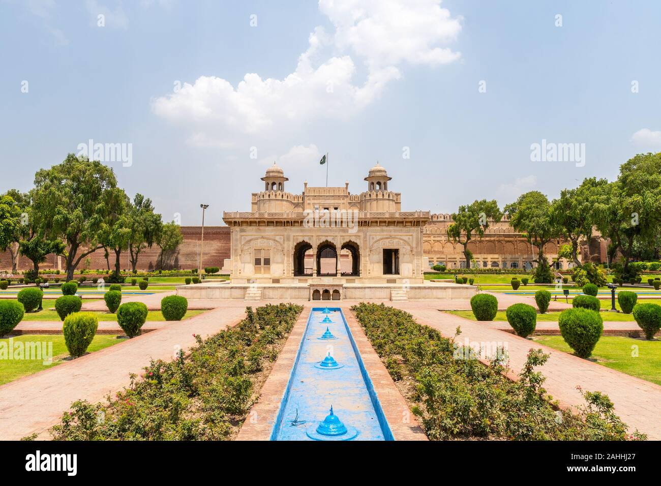 Lahore Fort Picturesque Breathtaking View of Hazuri Bagh Park and Alamgiri Gate with Waving Pakistan Flag on a Sunny Blue Sky Day Stock Photo