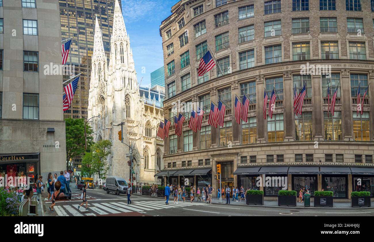 Manhattan, New York City, United States of America - St. Patrick's Cathedral next to Rockefeller Center Plaza, 5th ave, American flags street festival Stock Photo