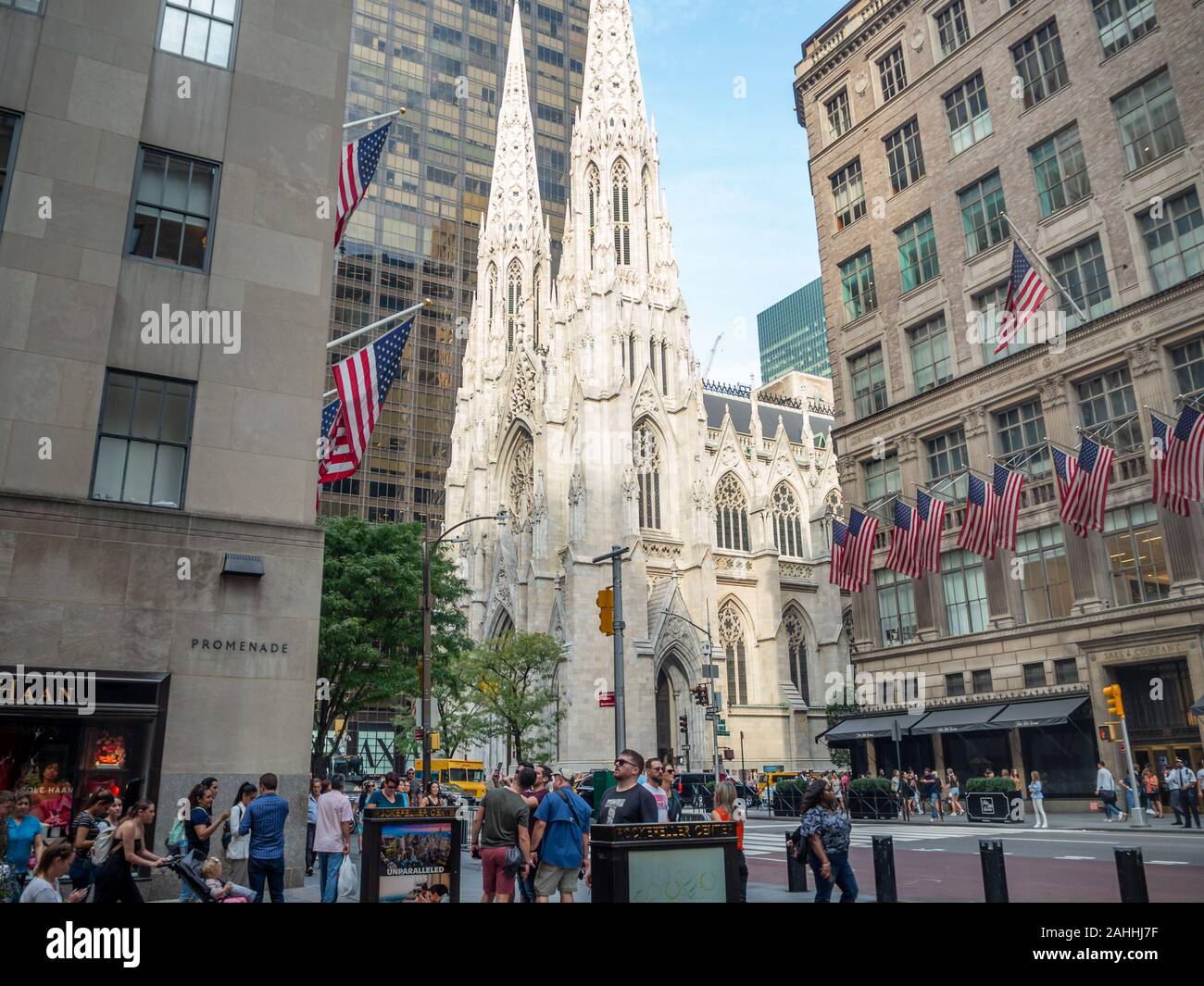 Manhattan, New York City, United States of America - St. Patrick's Cathedral next to Rockefeller Center Plaza, 5th ave, American flags street festival Stock Photo