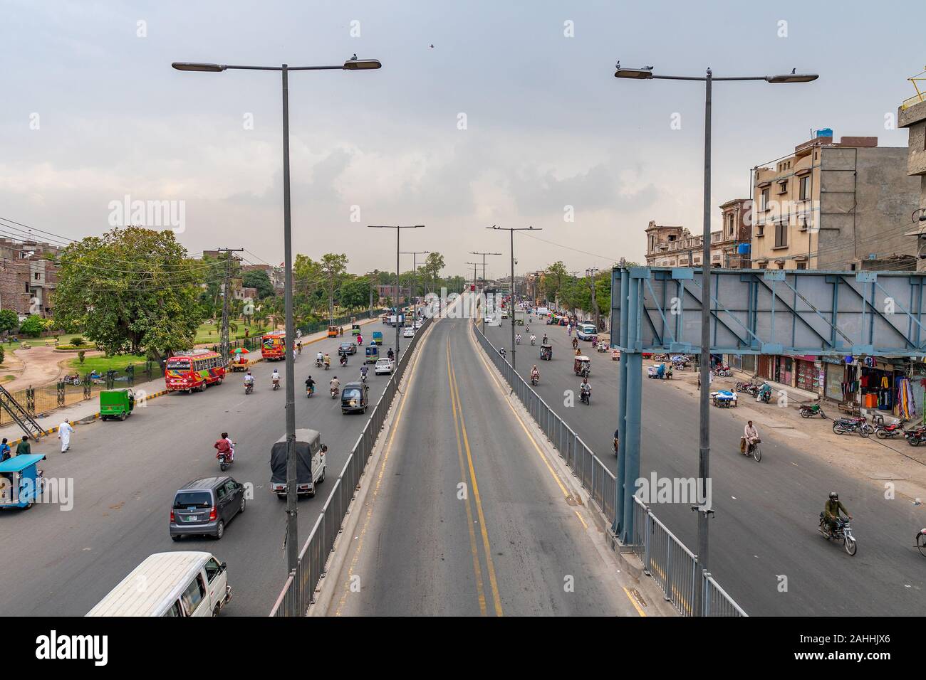 Lahore Data Darbar Road Picturesque View with Busy Traffic on a Cloudy Blue Sky Day Stock Photo