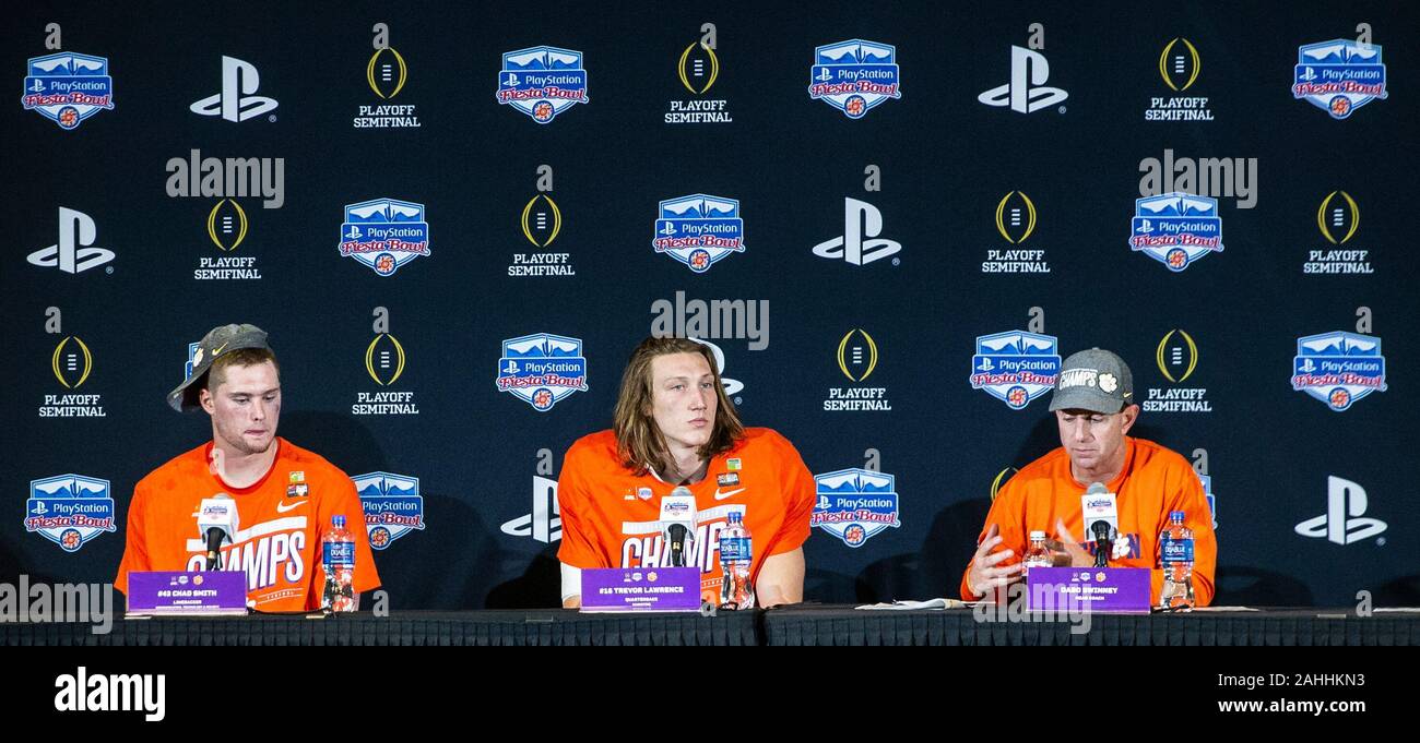 Glendale, AZ U.S. 28th Dec, 2019. A Clemson Tigers head coach Dado Swinney, quarterback Trevor Lawrence and linebacker Chad Smith (43) during the post game interview after the NCAA PlayStation Fiesta Bowl football game between Ohio State Buckeyes and the Clemson Tigers 29-23 win at State Farm stadium Glendale, AZ Thurman James/CSM/Alamy Live News Stock Photo