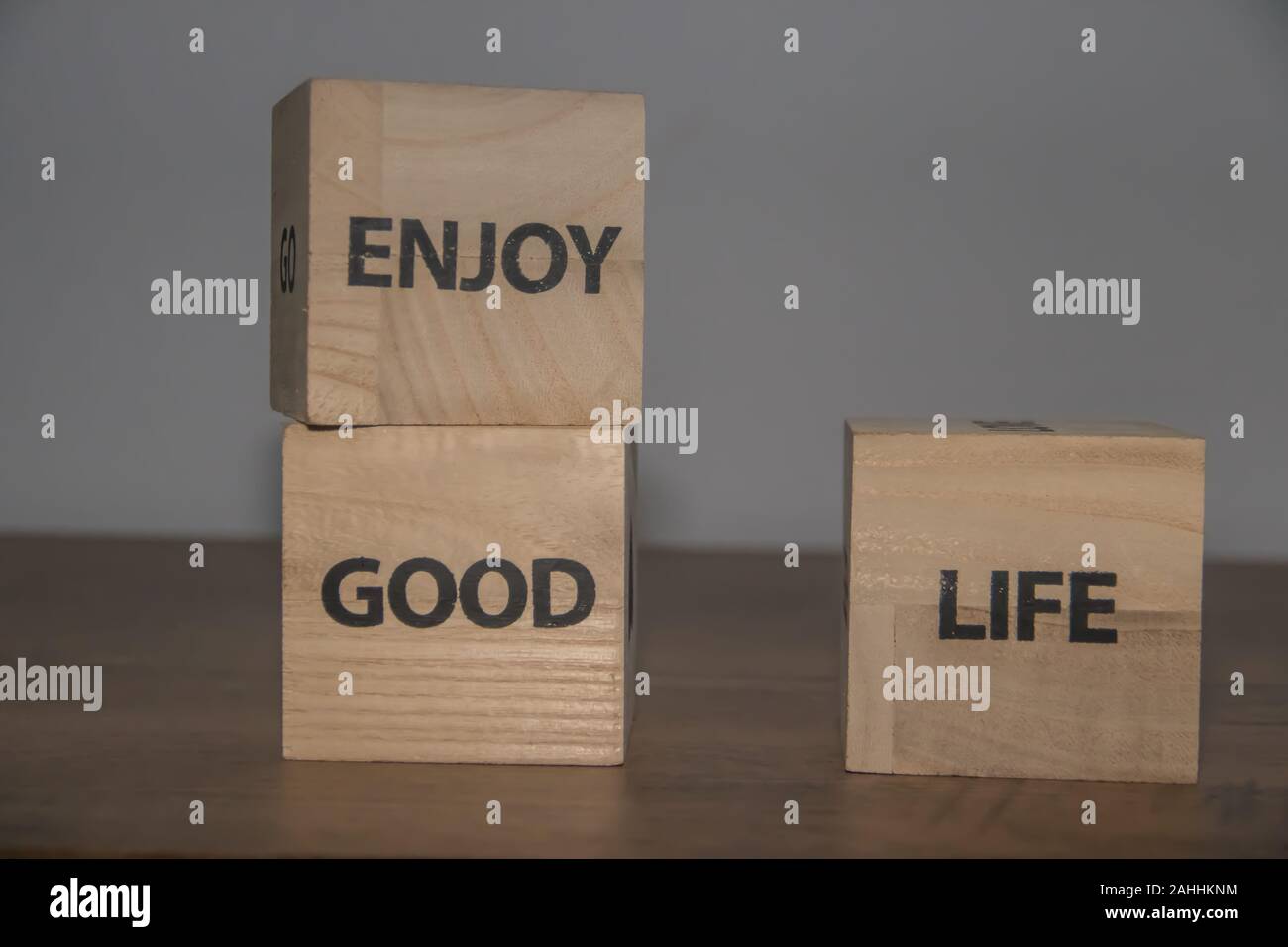 Enjoy good life, positive inspirational messages on wooden cubes Stock Photo