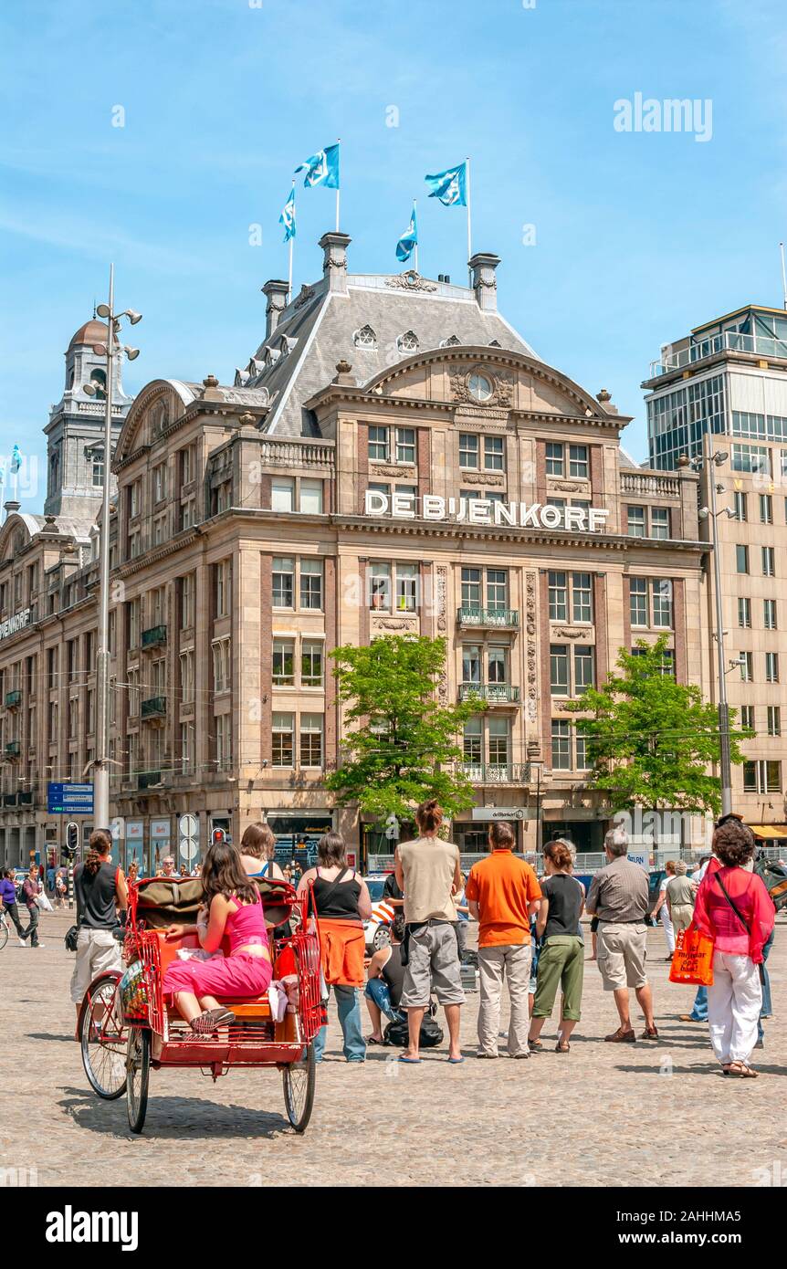 De Bijendorf Department Store at the Damrak shopping street in the inner city of Amsterdam, Holland. Stock Photo